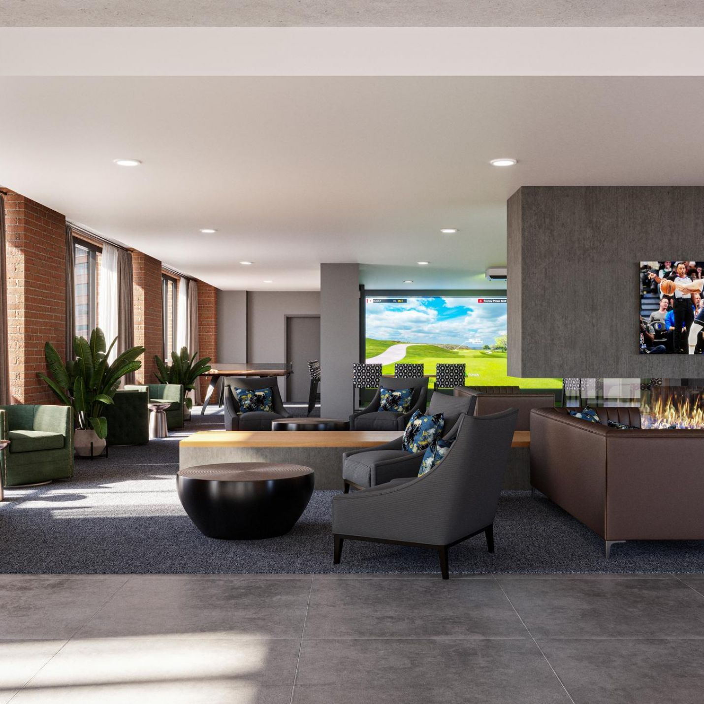 The Wade Stylish lobby area equipped with a large television and plush couches, designed for comfort and social interaction.