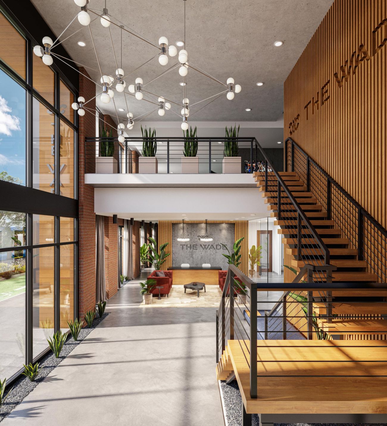 The Wade Modern office building lobby featuring stairs and a large window, allowing natural light to illuminate the space.